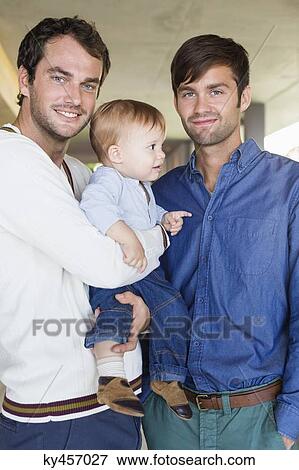 Parents smiling with their son at home View Large Photo Image Stock Photo - Parents smiling with their son at home. Fotosearch