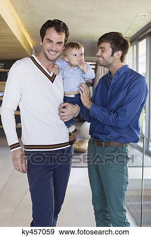 Parents smiling with their son at home View Large Photo Image Stock Photo - Parents smiling with their son at home. Fotosearch