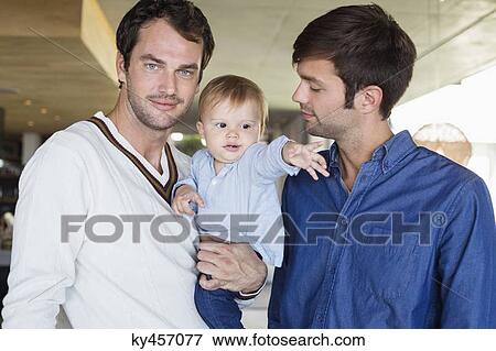 Parents smiling with their son at home View Large Photo Image Stock Photo - Parents smiling with their son at home. Fotosearch