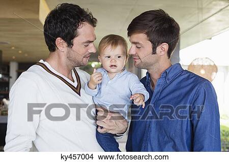 Parents with their son at home View Large Photo Image Picture - Parents with their son at home. Fotosearch