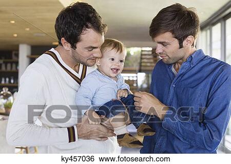 Parents with their son at home View Large Photo Image Stock Photograph - Parents with their son at home. Fotosearch