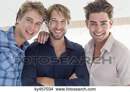 Portrait of three friends smiling together View Large Photo Image Picture - Portrait of three friends smiling together. Fotosearch