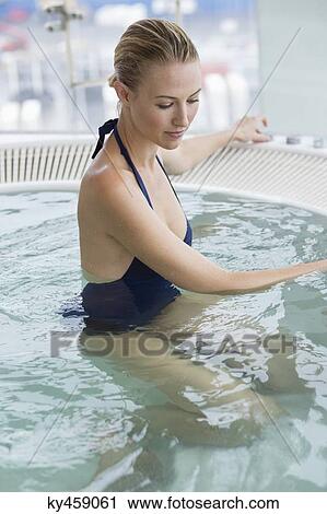 Beautiful woman in a hot tub View Large Photo Image Stock Image - Beautiful woman in a hot tub. Fotosearch