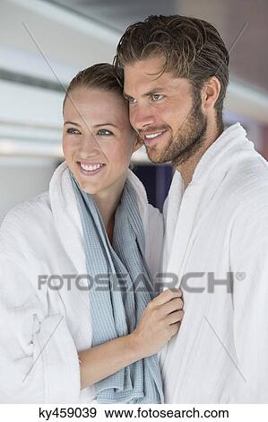 Stock Photo - Close-up of a smiling couple in bathrobes at spa. Fotosearch