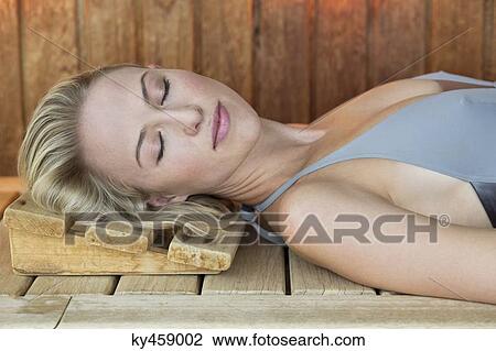 Close-up of a woman resting in a sauna View Large Photo Image Stock Image - Close-up of a woman resting in a sauna. Fotosearch
