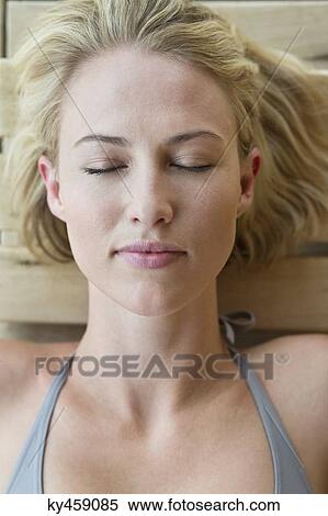 Stock Photography - Close-up of a woman resting in a sauna. Fotosearch