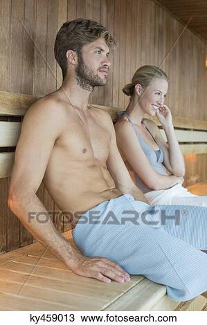Couple relaxing in a sauna View Large Photo Image Stock Image - Couple relaxing in a sauna. Fotosearch