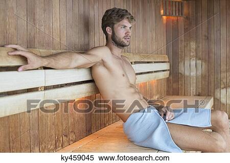 Man relaxing in a sauna View Large Photo Image Stock Photography - Man relaxing in a sauna. Fotosearch