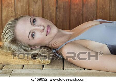 Stock Image - Portrait of a beautiful resting in a sauna. Fotosearch