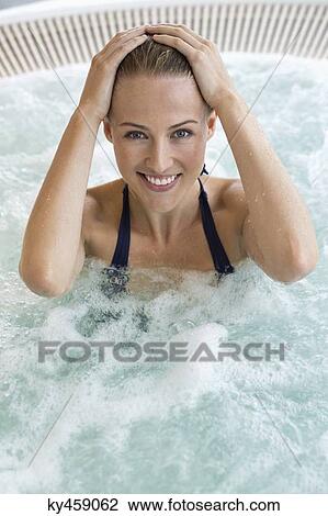 Portrait of a beautiful smiling woman in a hot tub View Large Photo Image Stock Image - Portrait of a beautiful smiling woman in a hot tub. Fotosearch