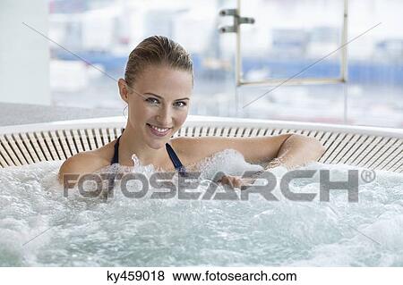 Portrait of a beautiful smiling woman in a hot tub View Large Photo Image Stock Photo - Portrait of a beautiful smiling woman in a hot tub. Fotosearch