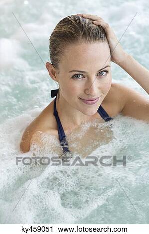 Portrait of a beautiful woman in a hot tub View Large Photo Image Stock Image - Portrait of a beautiful woman in a hot tub. Fotosearch