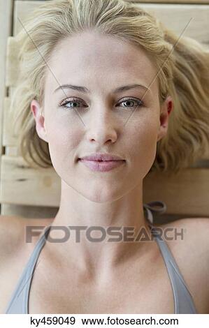 Stock Photo - Portrait of a beautiful woman resting in a sauna. Fotosearch