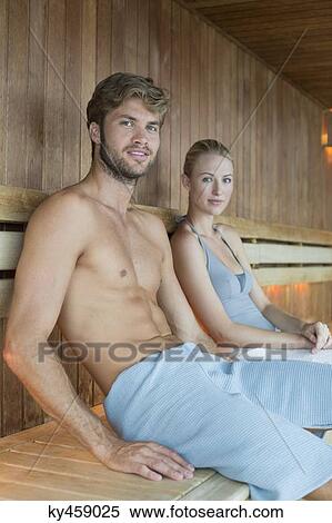 Stock Photography - Portrait of a couple relaxing in a sauna. Fotosearch