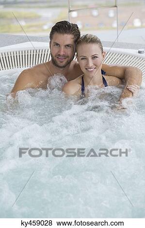 Portrait of a smiling couple in a hot tub View Large Photo Image Stock Photo - Portrait of a smiling couple in a hot tub. Fotosearch