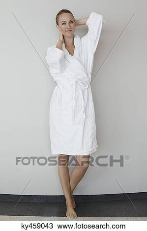 Stock Image - Portrait of a woman in bathrobe at spa. Fotosearch