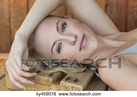 Portrait of a woman resting in a sauna View Large Photo Image Stock Photo - Portrait of a woman resting in a sauna. Fotosearch