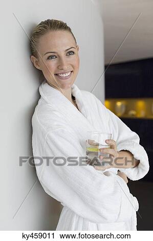 Woman in bathrobe drinking lemonade at spa View Large Photo Image Stock Image - Woman in bathrobe drinking lemonade at spa. Fotosearch