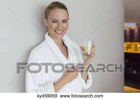 Woman in bathrobe drinking lemonade at spa View Large Photo Image Stock Photo - Woman in bathrobe drinking lemonade at spa. Fotosearch