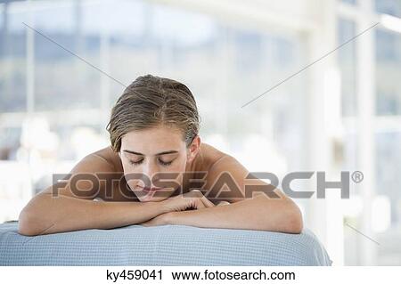 Stock Image - Woman lying on a massage table. Fotosearch