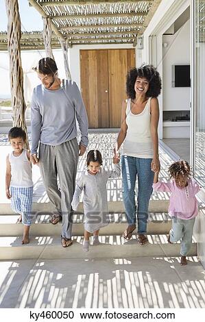 Couple walking with their children View Large Photo Image Stock Image - Couple walking with their children. Fotosearch