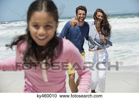 Family enjoying on the beach View Large Photo Image Stock Image - Family enjoying on the beach. Fotosearch