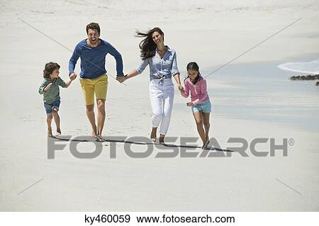 Family enjoying on the beach View Large Photo Image Stock Photo - Family enjoying on the beach. Fotosearch