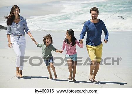 Family enjoying on the beach View Large Photo Image Stock Photograph - Family enjoying on the beach. Fotosearch