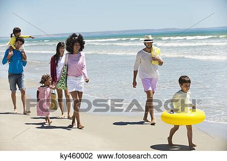 Family enjoying vacations on the beach View Large Photo Image Stock Image - Family enjoying vacations on the beach. Fotosearch
