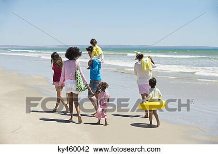 Family enjoying vacations on the beach View Large Photo Image Stock Image - Family enjoying vacations on the beach. Fotosearch