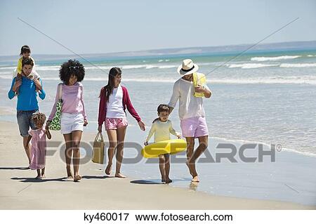 Family enjoying vacations on the beach View Large Photo Image Stock Photo - Family enjoying vacations on the beach. Fotosearch