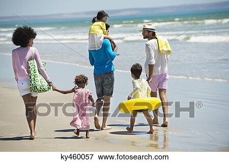 Family enjoying vacations on the beach View Large Photo Image Stock Photo - Family enjoying vacations on the beach. Fotosearch