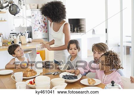 Family at breakfast table View Large Photo Image Stock Image - Family at breakfast table. Fotosearch