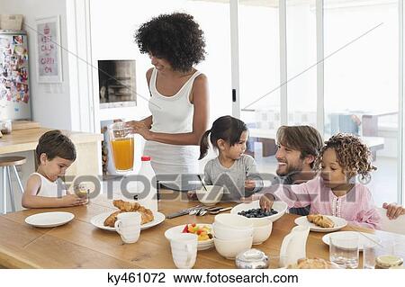 Family at breakfast table View Large Photo Image Stock Image - Family at breakfast table. Fotosearch