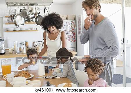 Family at breakfast table View Large Photo Image Stock Photo - Family at breakfast table. Fotosearch