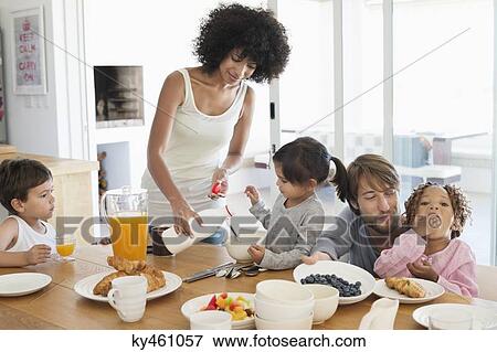 Family at breakfast table View Large Photo Image Stock Photo - Family at breakfast table. Fotosearch
