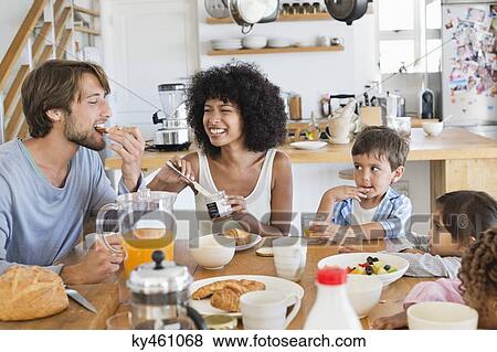 Family at breakfast table View Large Photo Image Stock Photo - Family at breakfast table. Fotosearch