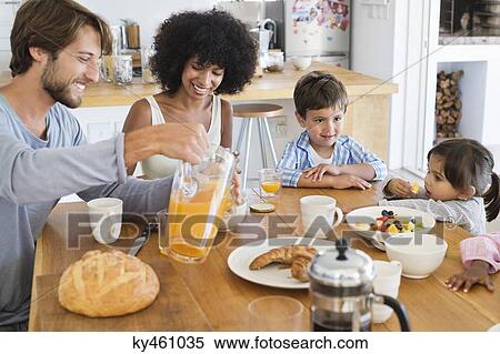 Family at breakfast table View Large Photo Image Stock Photography - Family at breakfast table. Fotosearch