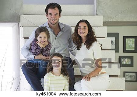 Family sitting on steps and smiling View Large Photo Image Picture - Family sitting on steps and smiling. Fotosearch