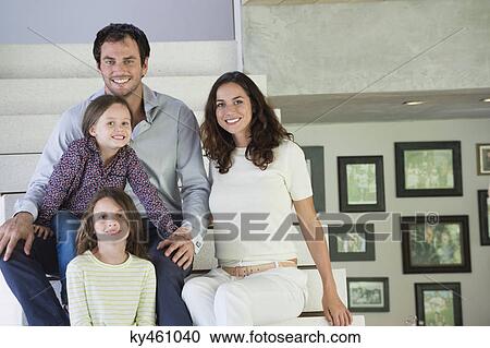 Family sitting on steps and smiling View Large Photo Image Stock Image - Family sitting on steps and smiling. Fotosearch