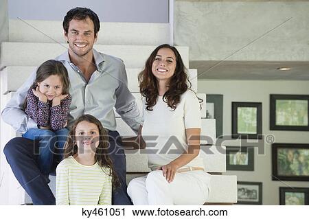 Family sitting on steps and smiling View Large Photo Image Stock Image - Family sitting on steps and smiling. Fotosearch