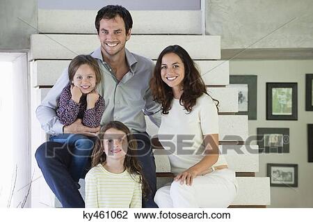 Family sitting on steps and smiling View Large Photo Image Stock Image - Family sitting on steps and smiling. Fotosearch