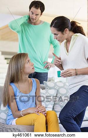 Parents scolding their daughter at home View Large Photo Image Stock Image - Parents scolding their daughter at home. Fotosearch
