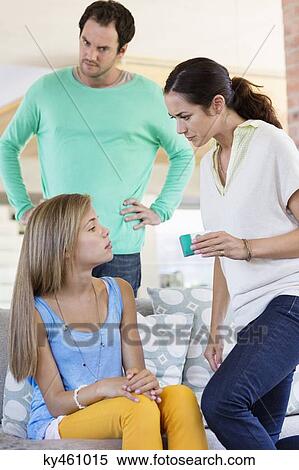 Parents scolding their daughter at home View Large Photo Image Stock Photography - Parents scolding their daughter at home. Fotosearch