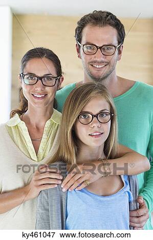 Portrait of a family wearing eyeglasses and smiling View Large Photo Image Stock Photo - Portrait of a family wearing eyeglasses and smiling. Fotosearch