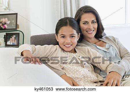 Portrait of a woman and her daughter smiling View Large Photo Image Stock Image - Portrait of a woman and her daughter smiling. Fotosearch