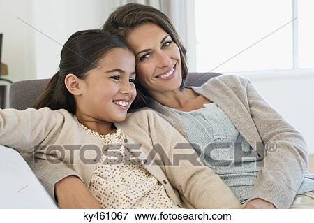 Portrait of a woman and her daughter smiling View Large Photo Image Stock Photo - Portrait of a woman and her daughter smiling. Fotosearch