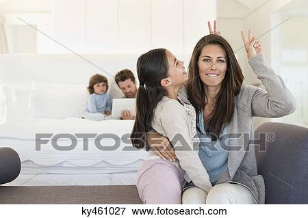 Stock Photo - Woman and her daughter enjoying. Fotosearch