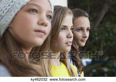 Close-up of three girls staring View Large Photo Image Stock Image - Close-up of three girls staring. Fotosearch