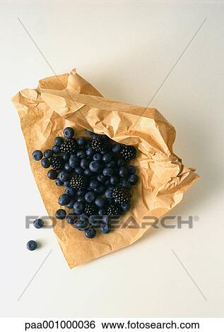 Blueberries and blackberries on brown paper View Large Photo Image Stock Photograph - Blueberries and blackberries on brown paper. Fotosearch